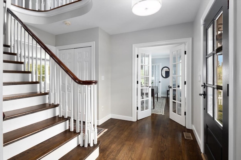 88 Jedediah's Path Marshfield, MA 02050 - Photo 3 of 41 a view of a hallway with wooden floor and staircase