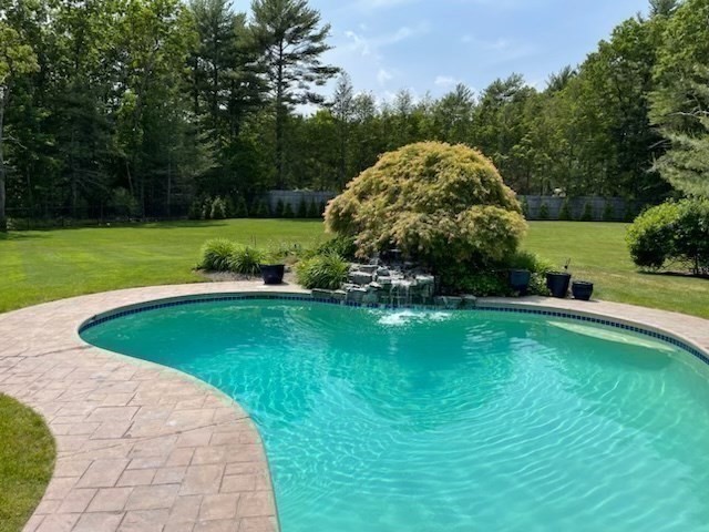 88 Jedediah's Path Marshfield, MA 02050 - Photo 31 of 41 a view of a garden with a swimming pool and green space