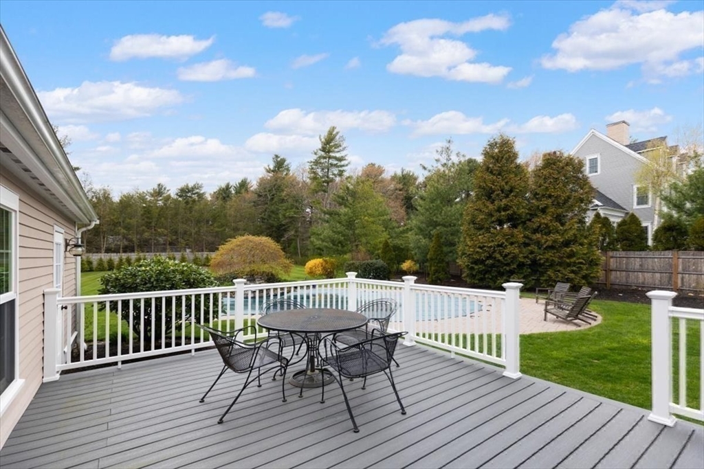 88 Jedediah's Path Marshfield, MA 02050 - Photo 36 of 41 a view of a roof deck with table and chairs and wooden floor