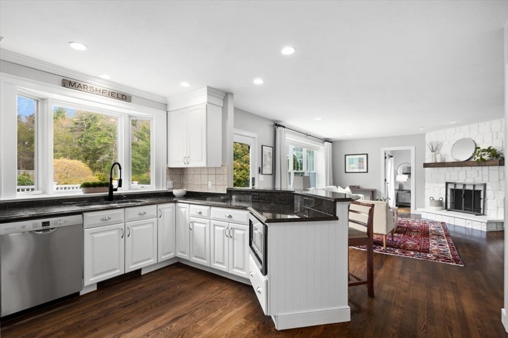88 Jedediah's Path Marshfield, MA 02050 - Photo 6 of 41 a kitchen with stainless steel appliances granite countertop a stove and cabinets