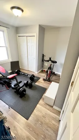 a room with furniture and gym equipment
