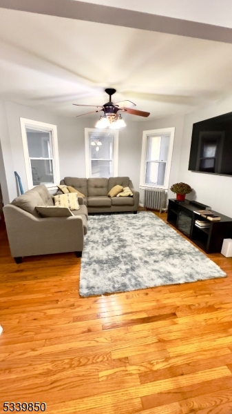 511 Hussa Street, Unit 2 Linden, NJ 07036 - Photo 3 of 13 a living room with furniture and a flat screen tv
