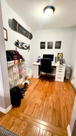 a bed room with a bed and a television