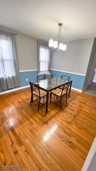 511 Hussa Street, Unit 2 Linden, NJ 07036 - Photo 5 of 13 a view of a dining room with furniture and wooden floor