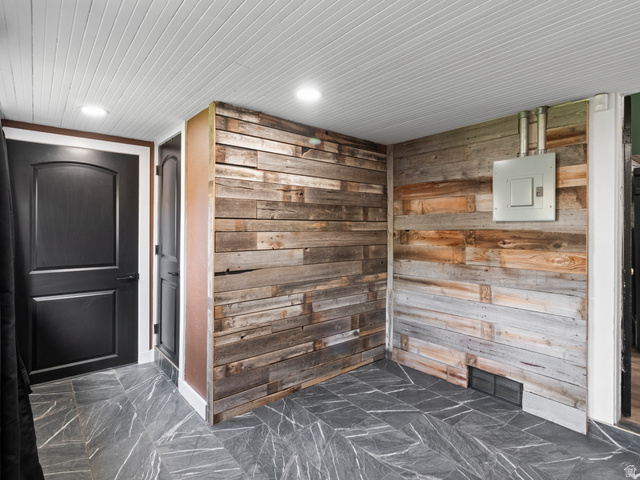 158 East 300 South Logan, UT 84321 - Photo 15 of 25 Mudroom featuring wood walls and electric panel