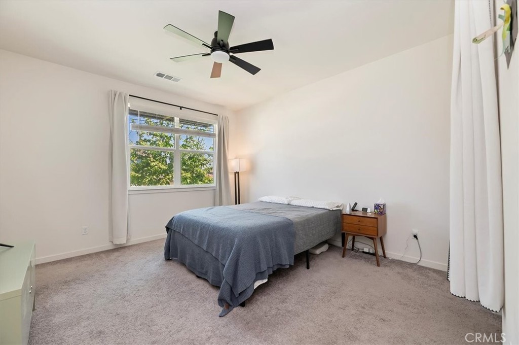11012 Serenity Drive Rancho Cucamonga, CA 91730 - Photo 15 of 37 a bedroom with a bed and a window