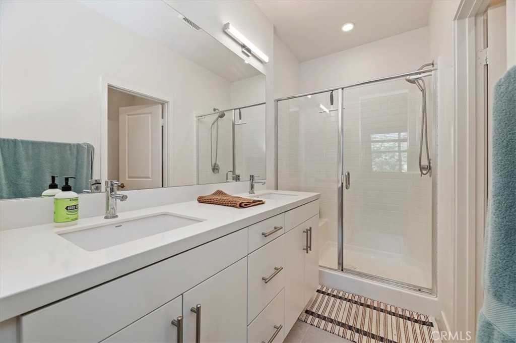 11012 Serenity Drive Rancho Cucamonga, CA 91730 - Photo 17 of 37 a bathroom with a sink and a mirror