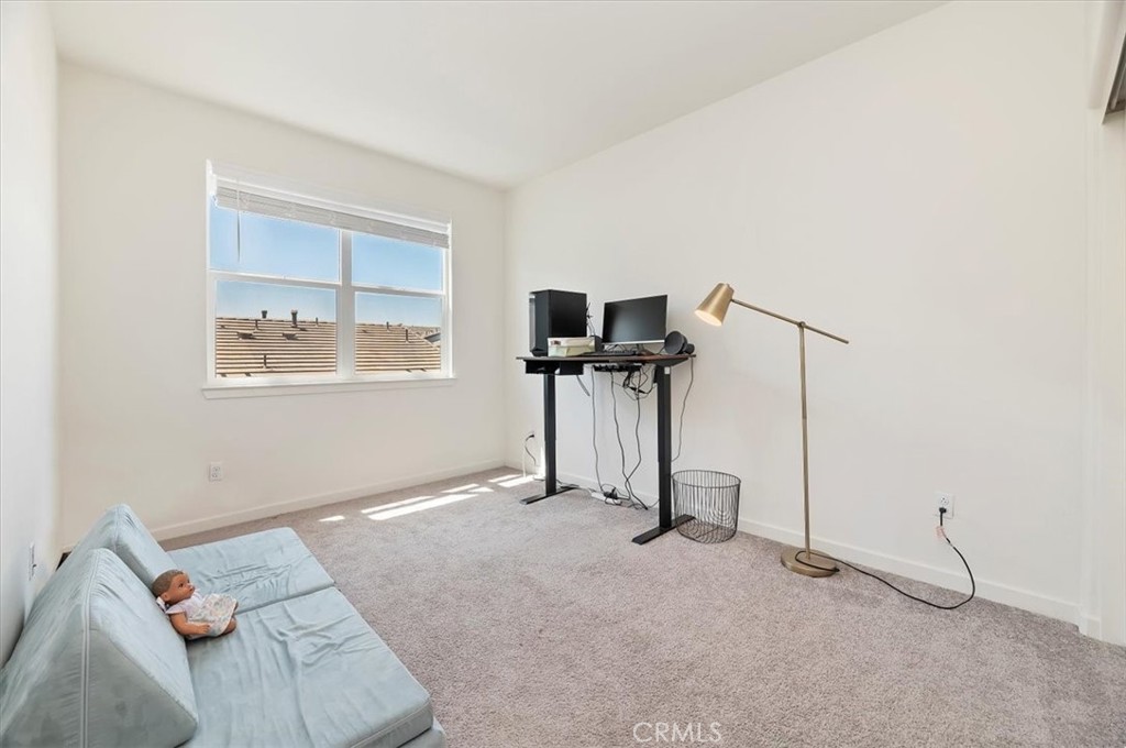 11012 Serenity Drive Rancho Cucamonga, CA 91730 - Photo 18 of 37 a room with furniture and a flat screen tv