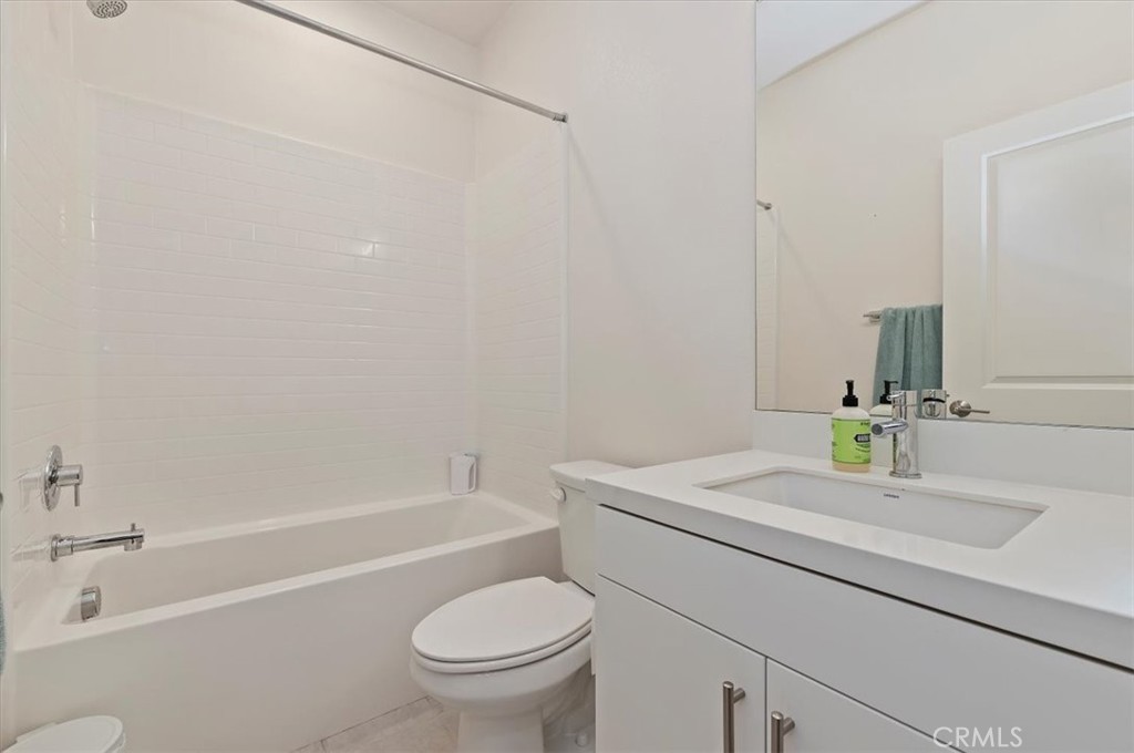11012 Serenity Drive Rancho Cucamonga, CA 91730 - Photo 19 of 37 a bathroom with a sink a toilet and bathtub