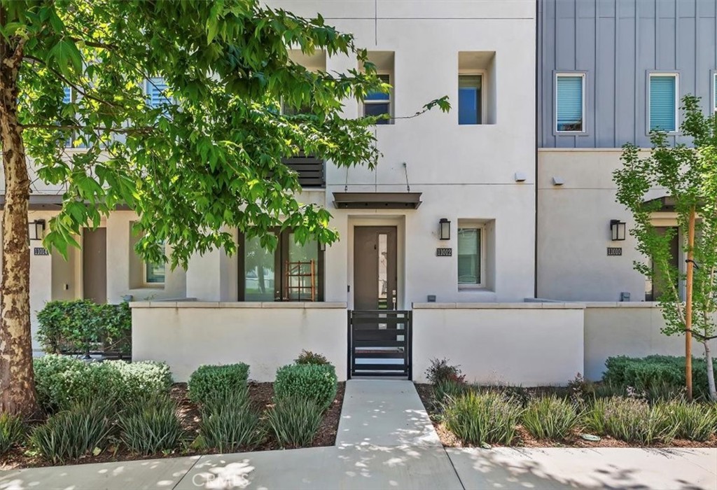 11012 Serenity Drive Rancho Cucamonga, CA 91730 - Photo 24 of 37 front view of a house with potted plants