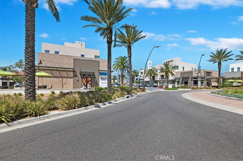 11012 Serenity Drive Rancho Cucamonga, CA 91730 - Photo 33 of 37 a street with a building and a street view