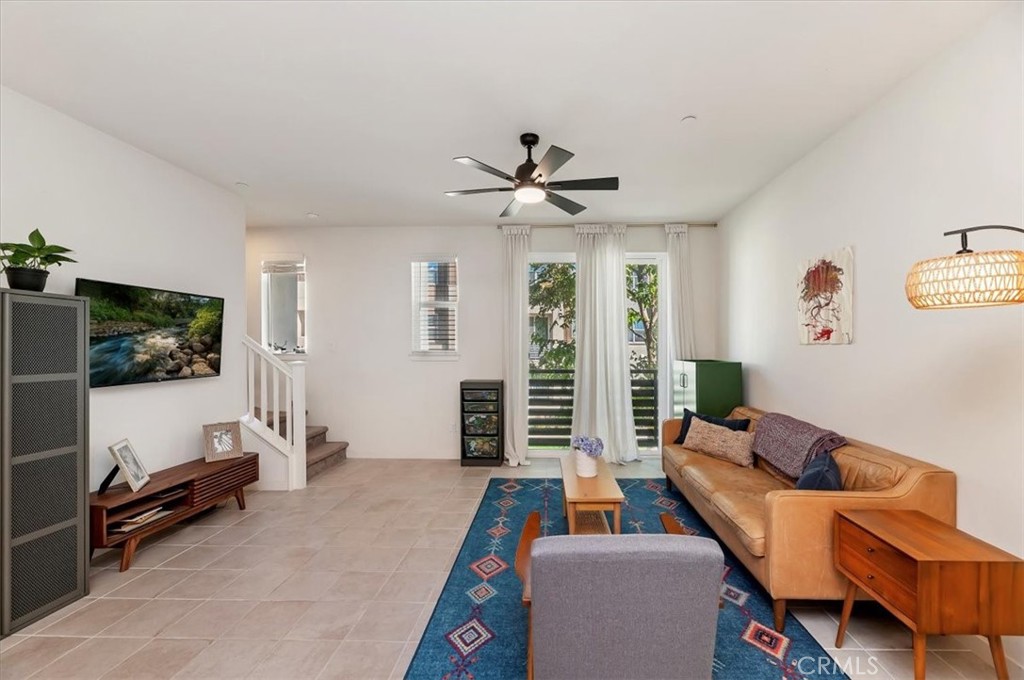 11012 Serenity Drive Rancho Cucamonga, CA 91730 - Photo 7 of 37 a living room with furniture and a flat screen tv