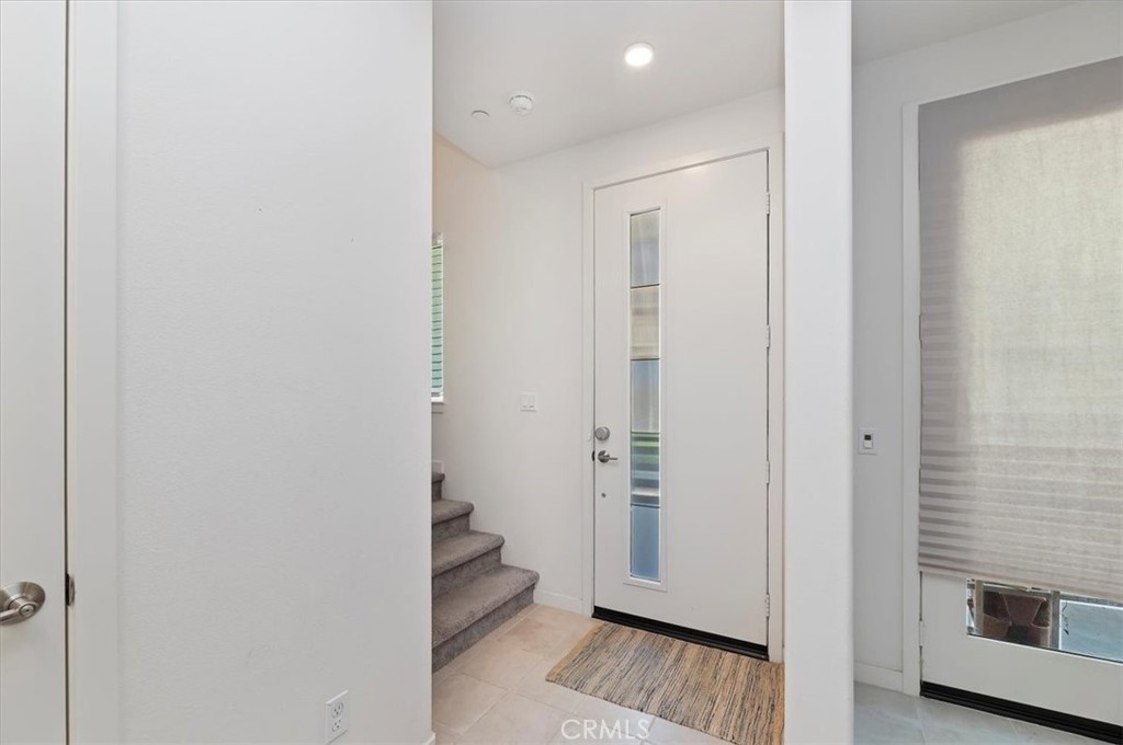 11012 Serenity Drive Rancho Cucamonga, CA 91730 - Photo 8 of 37 a view of a hallway with wooden floor and closet