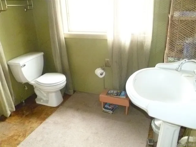 a front view of a house with outdoor seating