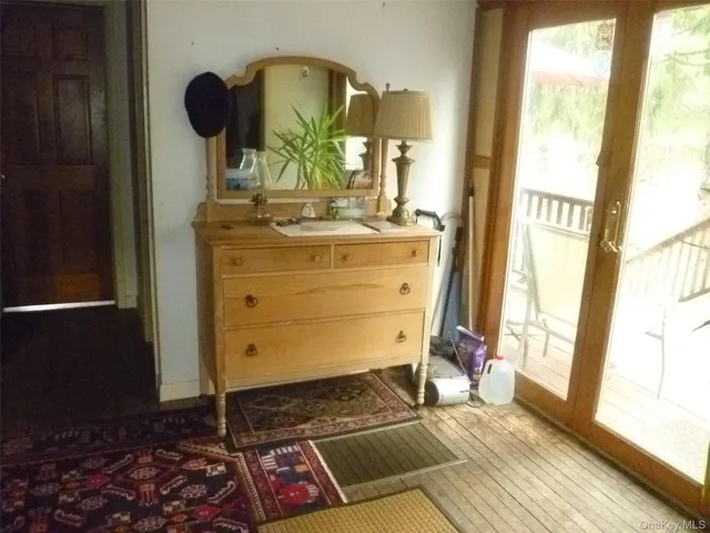 a view of an entryway with wooden floor