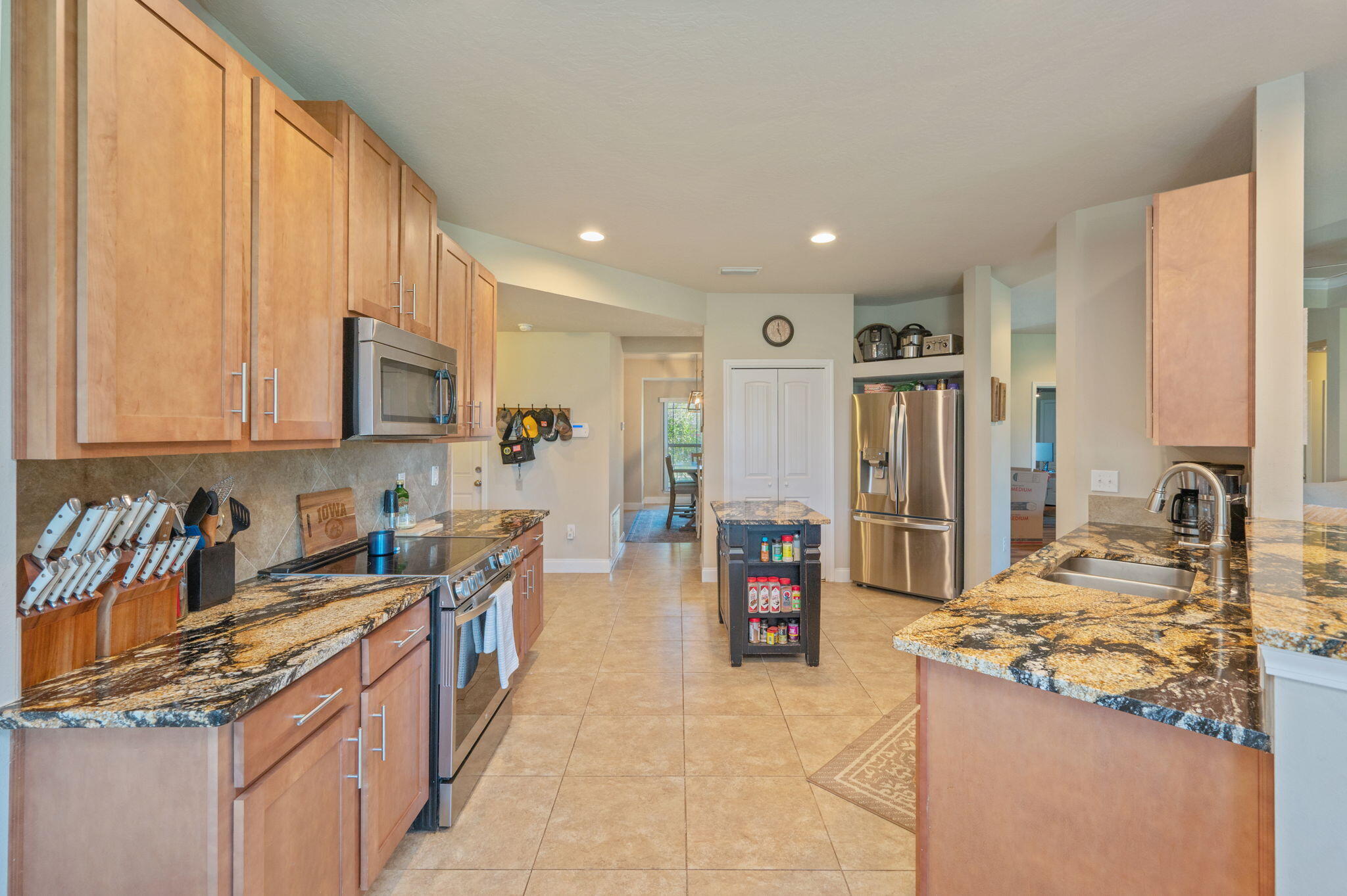 4675 Chanteuse Parkway Crestview, FL 32539 - Photo 18 of 48 a kitchen with stainless steel appliances granite countertop a sink stove and refrigerator