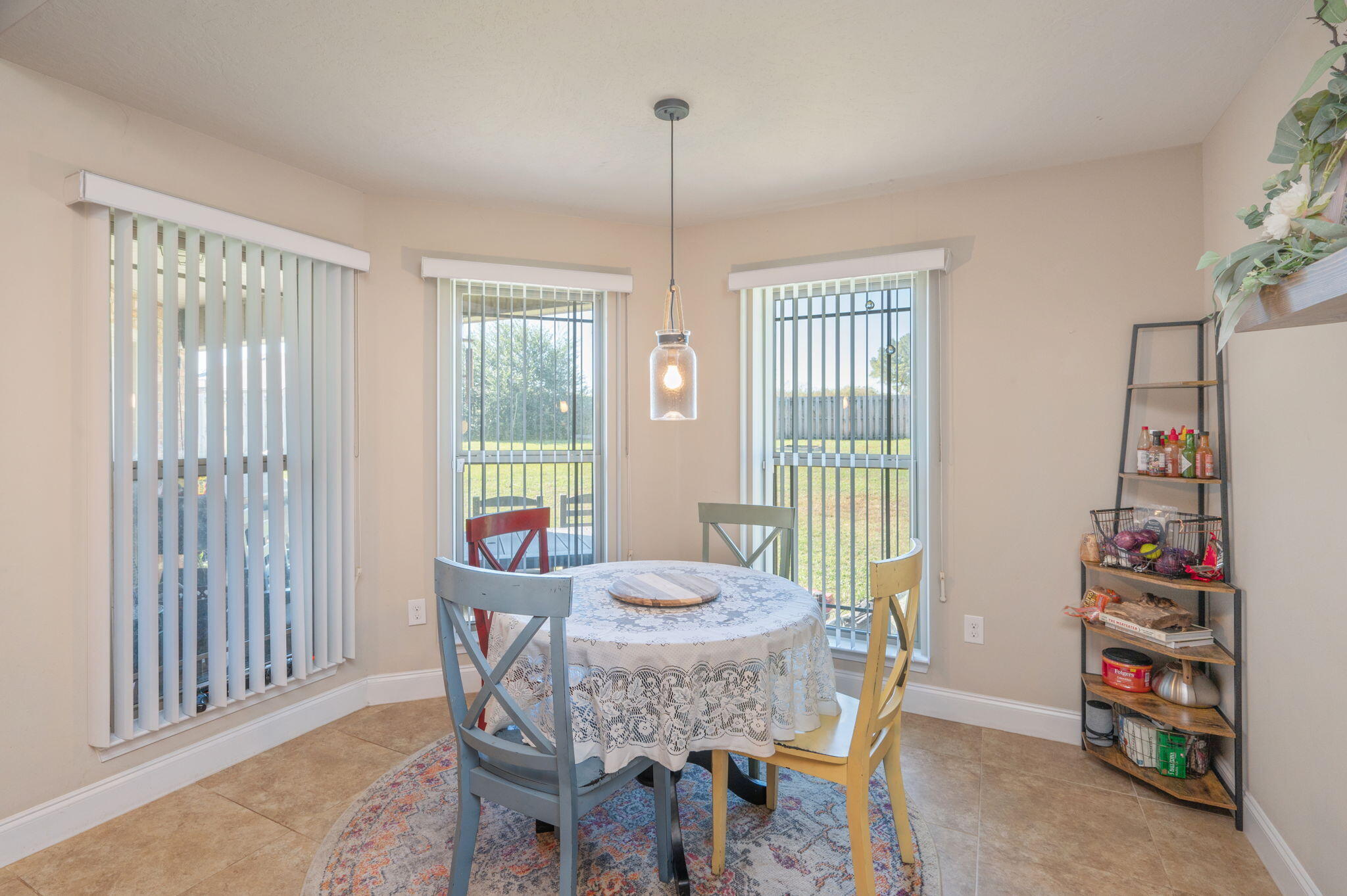 4675 Chanteuse Parkway Crestview, FL 32539 - Photo 19 of 48 a view of a dining room with furniture window and outside view