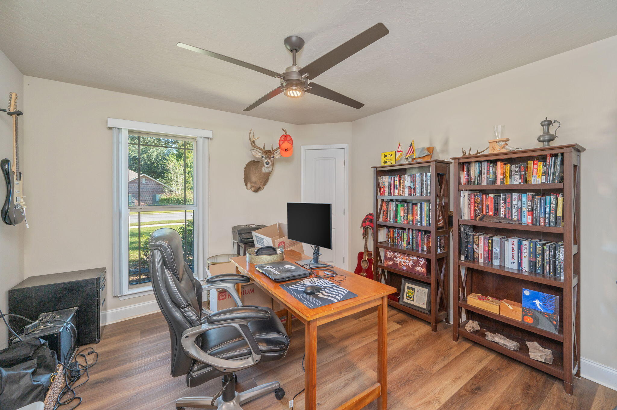 4675 Chanteuse Parkway Crestview, FL 32539 - Photo 20 of 48 a view of a workspace with furniture and a book shelf