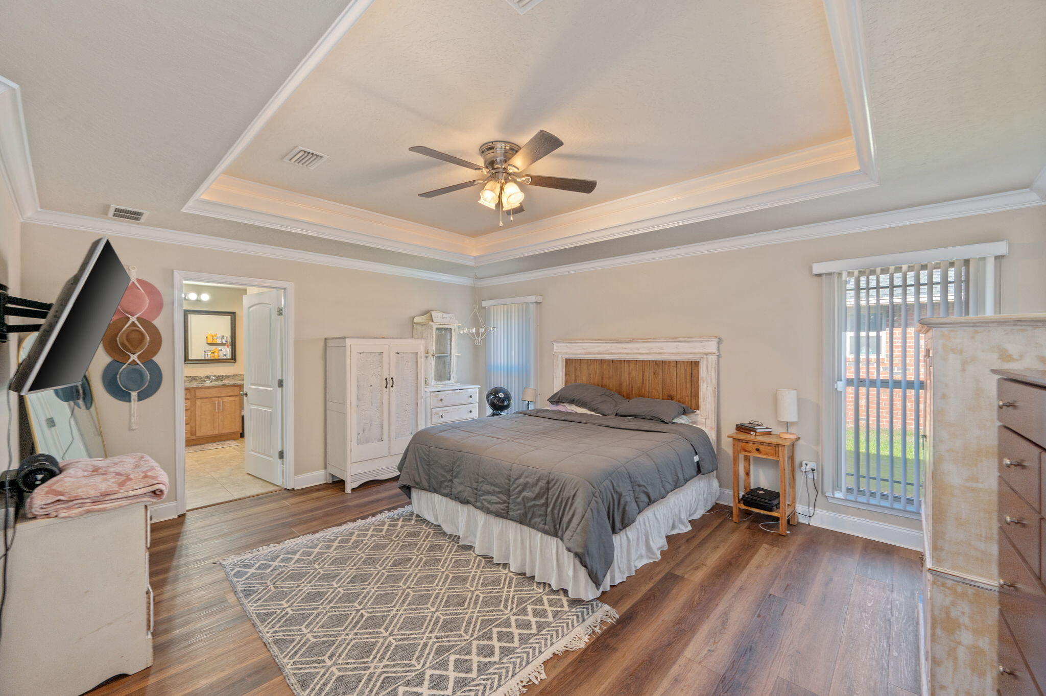4675 Chanteuse Parkway Crestview, FL 32539 - Photo 22 of 48 a spacious bedroom with a bed and a window