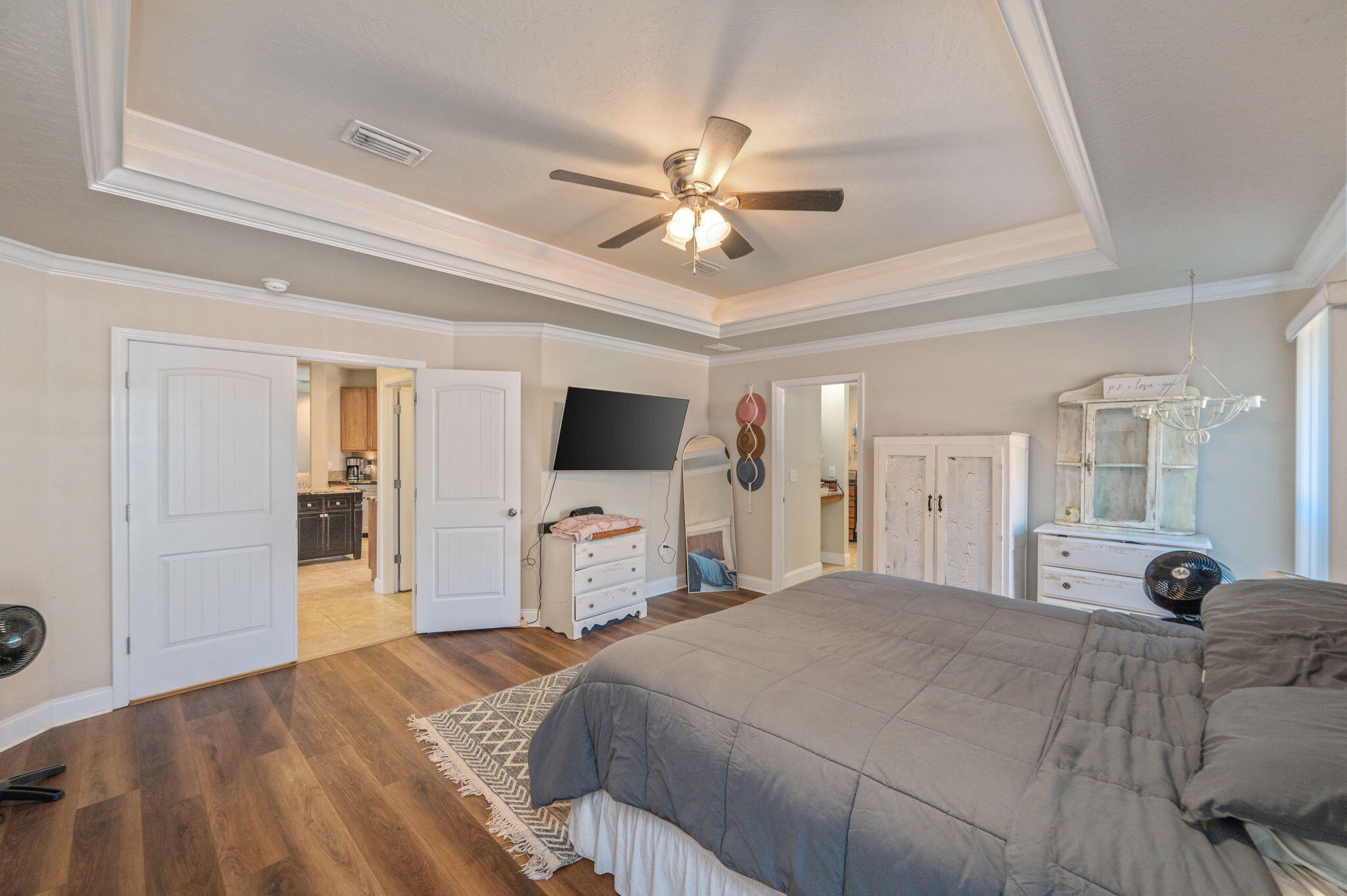 4675 Chanteuse Parkway Crestview, FL 32539 - Photo 23 of 48 a bedroom with a bed and a flat tv screen on dresser
