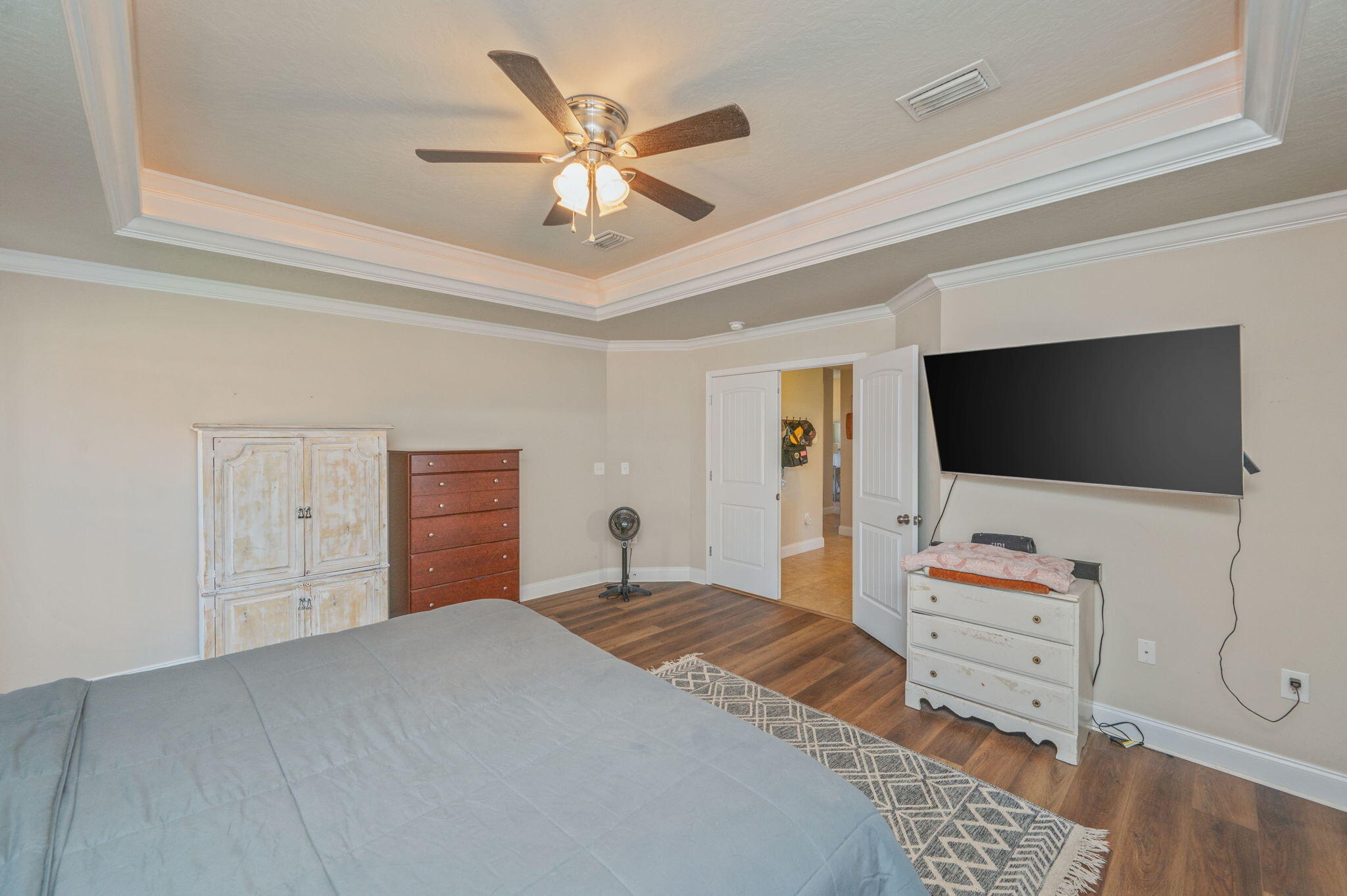 4675 Chanteuse Parkway Crestview, FL 32539 - Photo 24 of 48 a bedroom with a bed and a flat screen tv