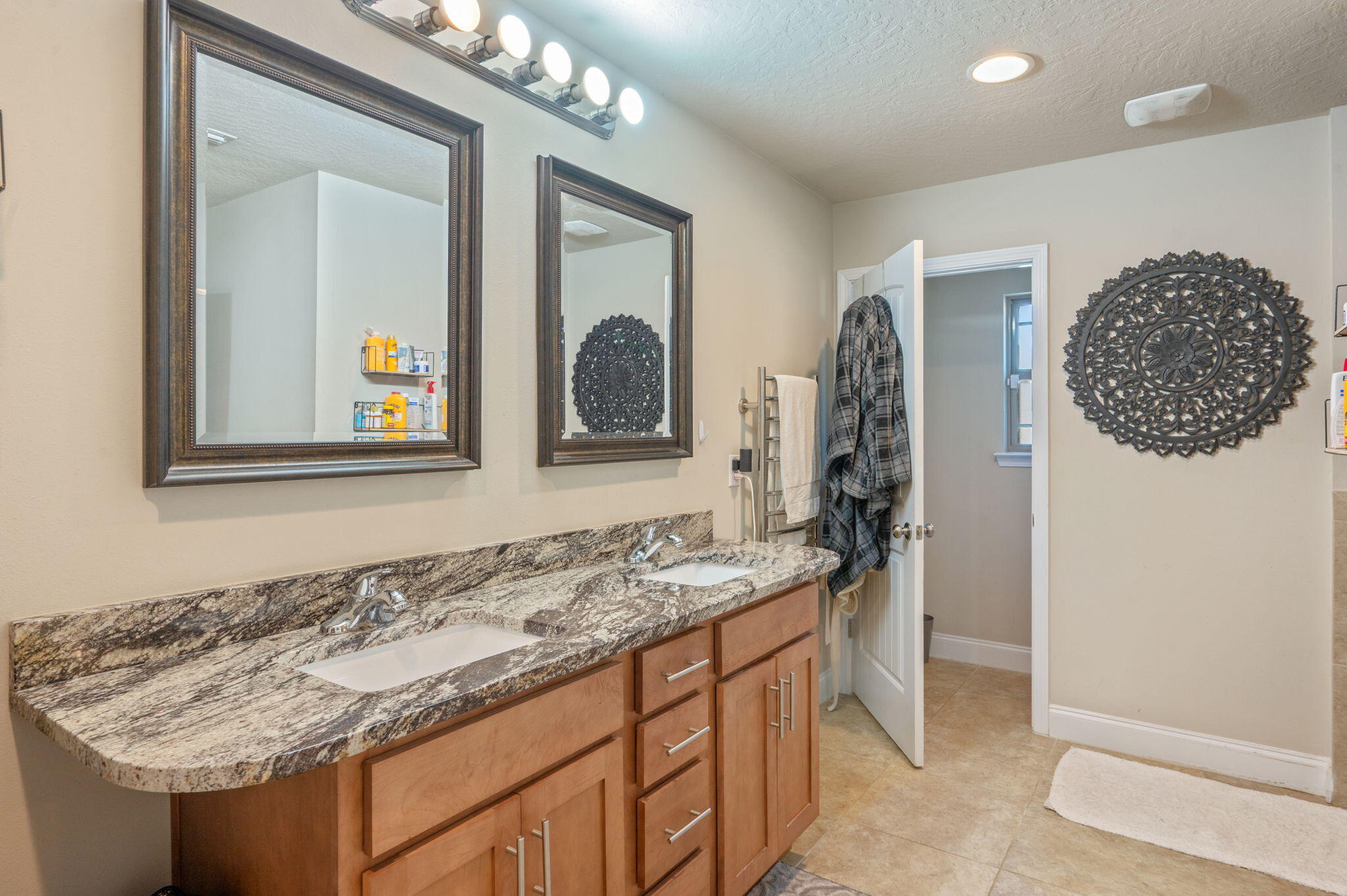 4675 Chanteuse Parkway Crestview, FL 32539 - Photo 28 of 48 a bathroom with a granite countertop sink and a mirror