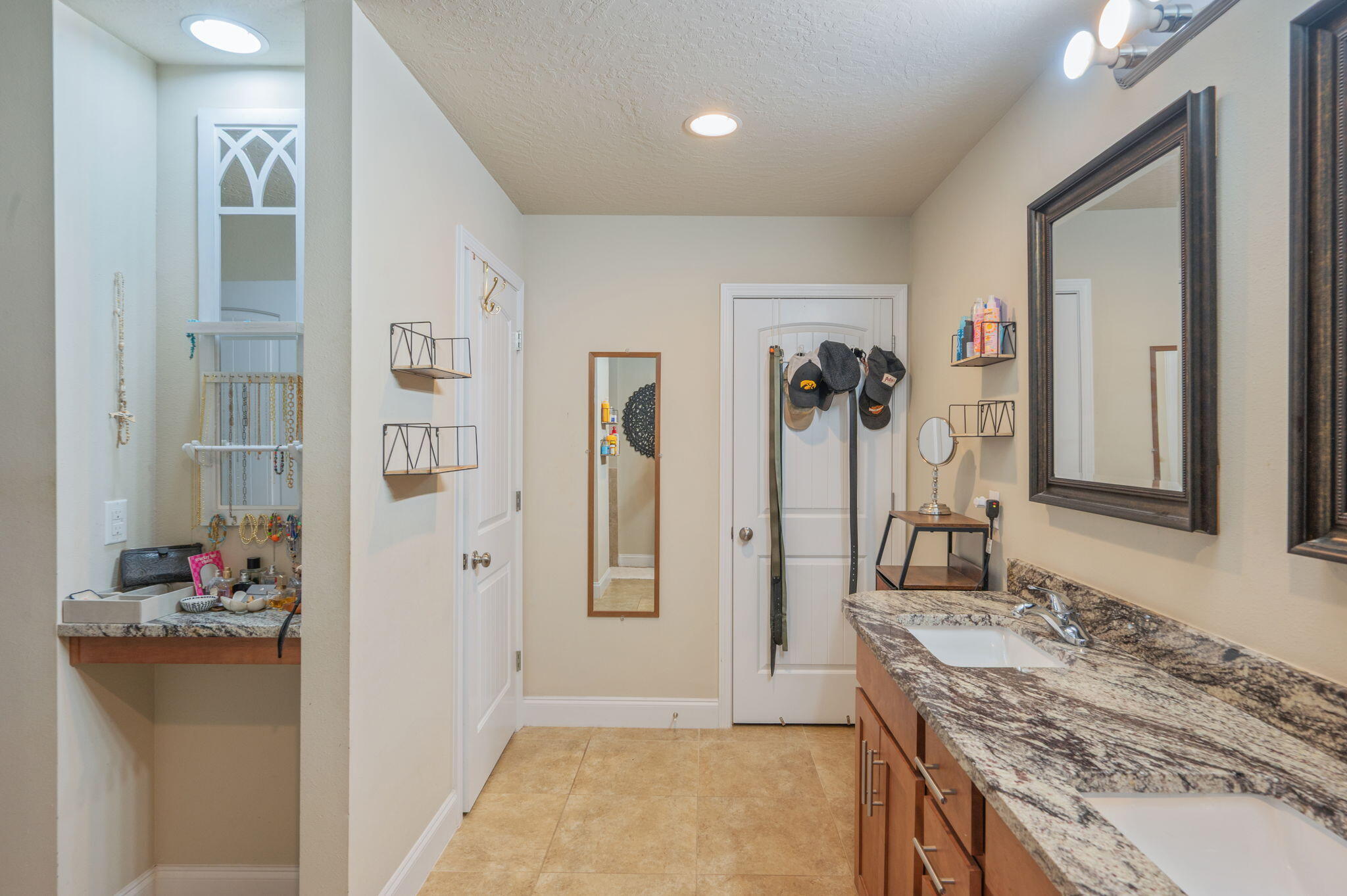 4675 Chanteuse Parkway Crestview, FL 32539 - Photo 29 of 48 a bathroom with a granite countertop sink and a mirror