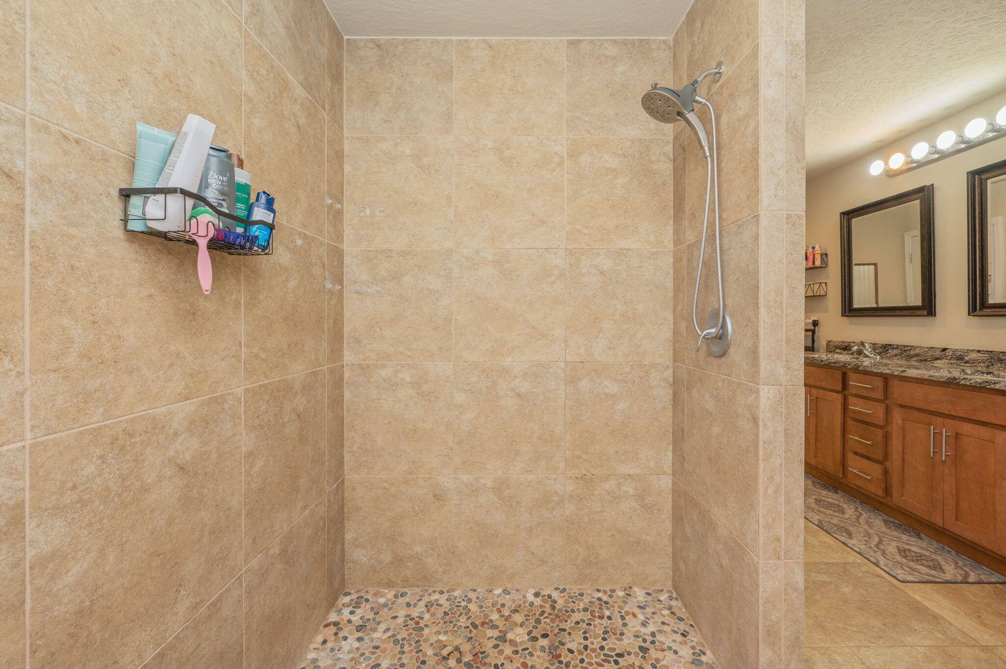4675 Chanteuse Parkway Crestview, FL 32539 - Photo 31 of 48 a bathroom with a granite countertop shower a sink and a stove