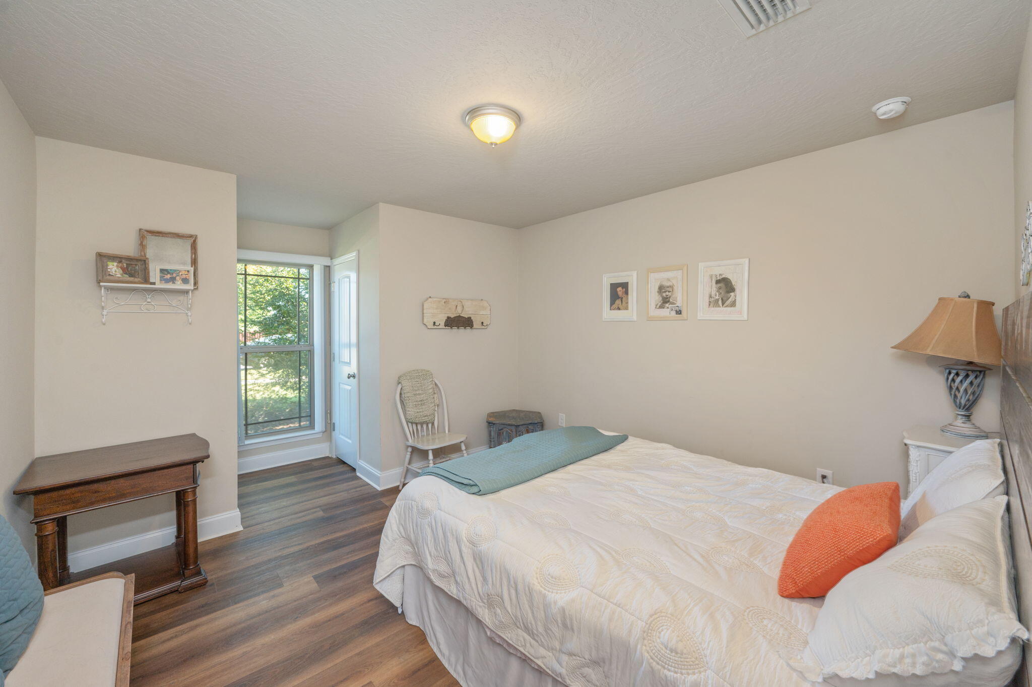 4675 Chanteuse Parkway Crestview, FL 32539 - Photo 32 of 48 a bedroom with a bed and wooden floor