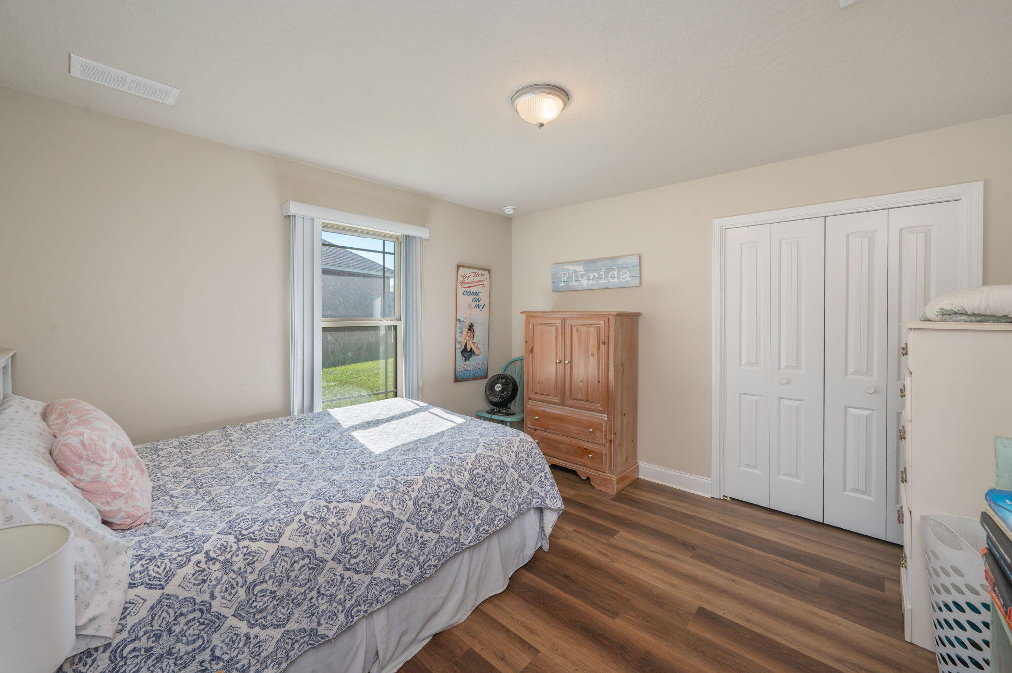 4675 Chanteuse Parkway Crestview, FL 32539 - Photo 35 of 48 a bedroom with a bed and a window