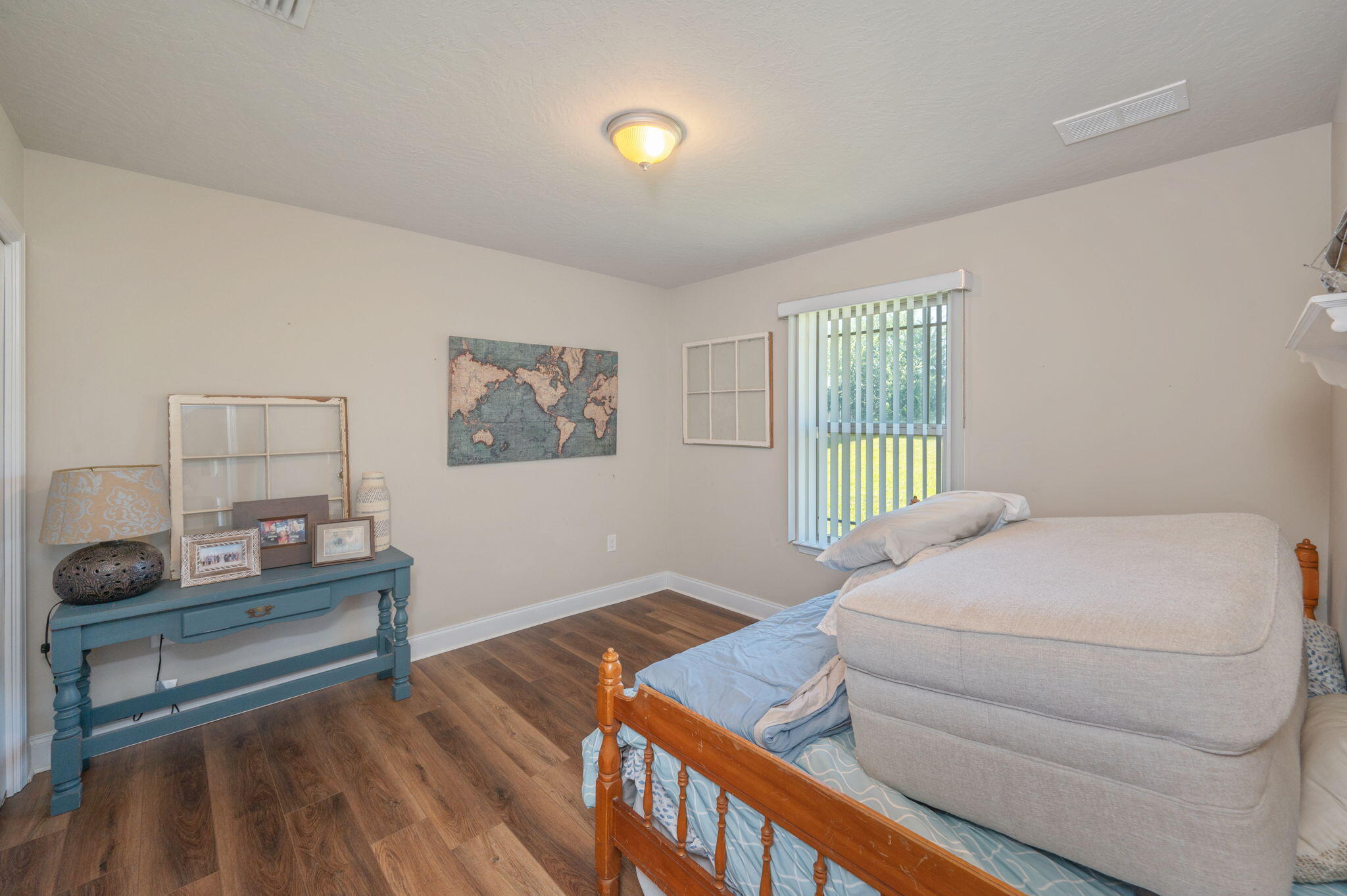 4675 Chanteuse Parkway Crestview, FL 32539 - Photo 39 of 48 a bedroom with a bed and a window