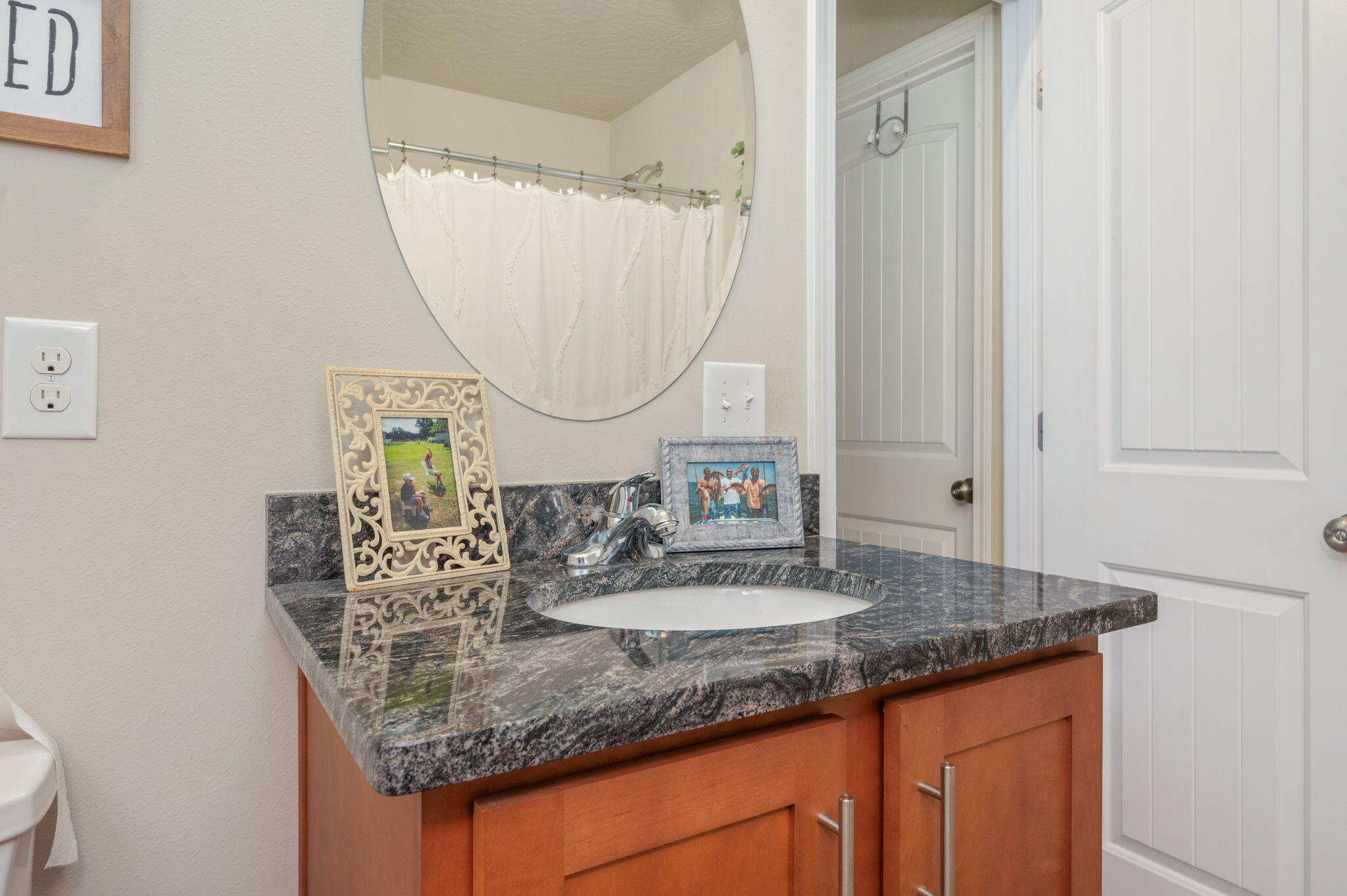 4675 Chanteuse Parkway Crestview, FL 32539 - Photo 42 of 48 a bathroom with a granite countertop sink and a mirror