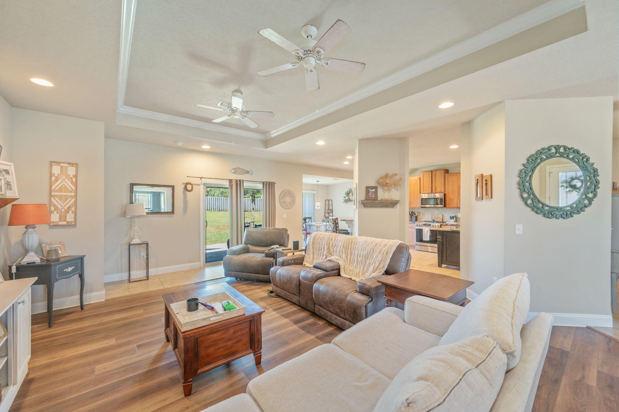 4675 Chanteuse Parkway Crestview, FL 32539 - Photo 9 of 48 a living room with furniture a clock on wall and a window