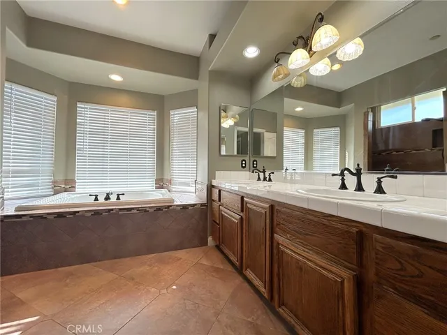 a bathroom with a toilet a sink and bathtub