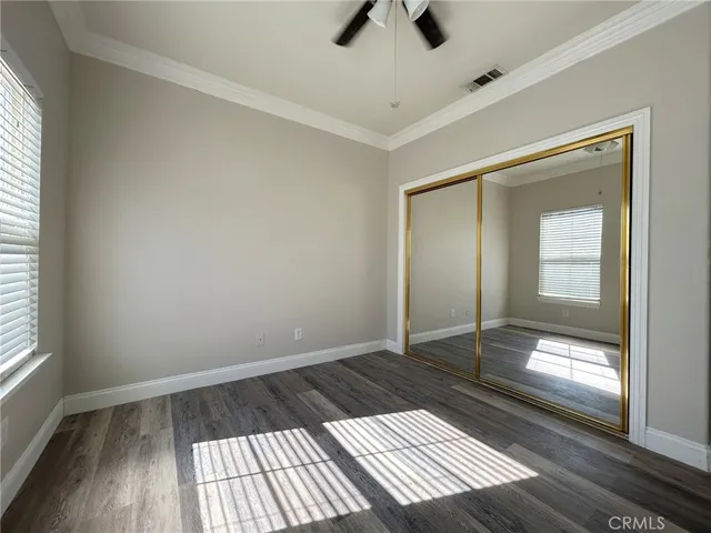 a view of an empty room and wooden floor