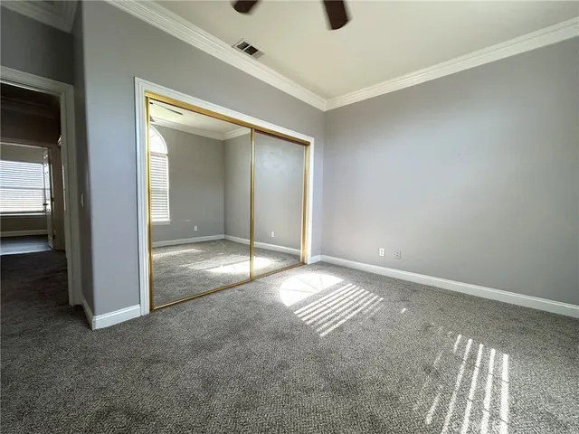 a bathroom with a double vanity sink mirror and toilet