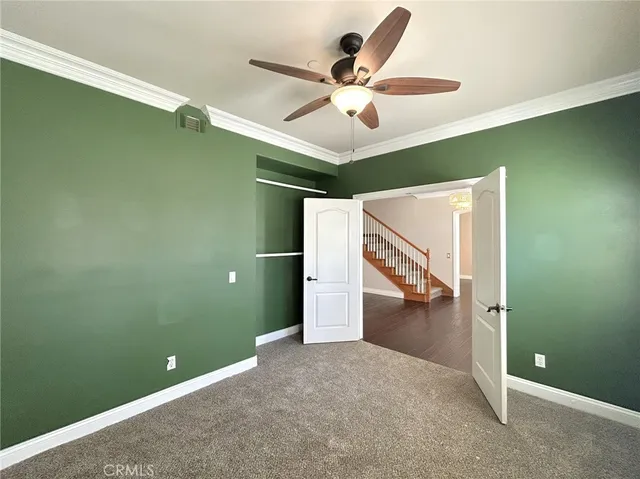 a bathroom with a granite countertop sink a toilet and a mirror