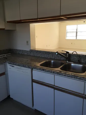 a bathroom with a sink a toilet and vanity