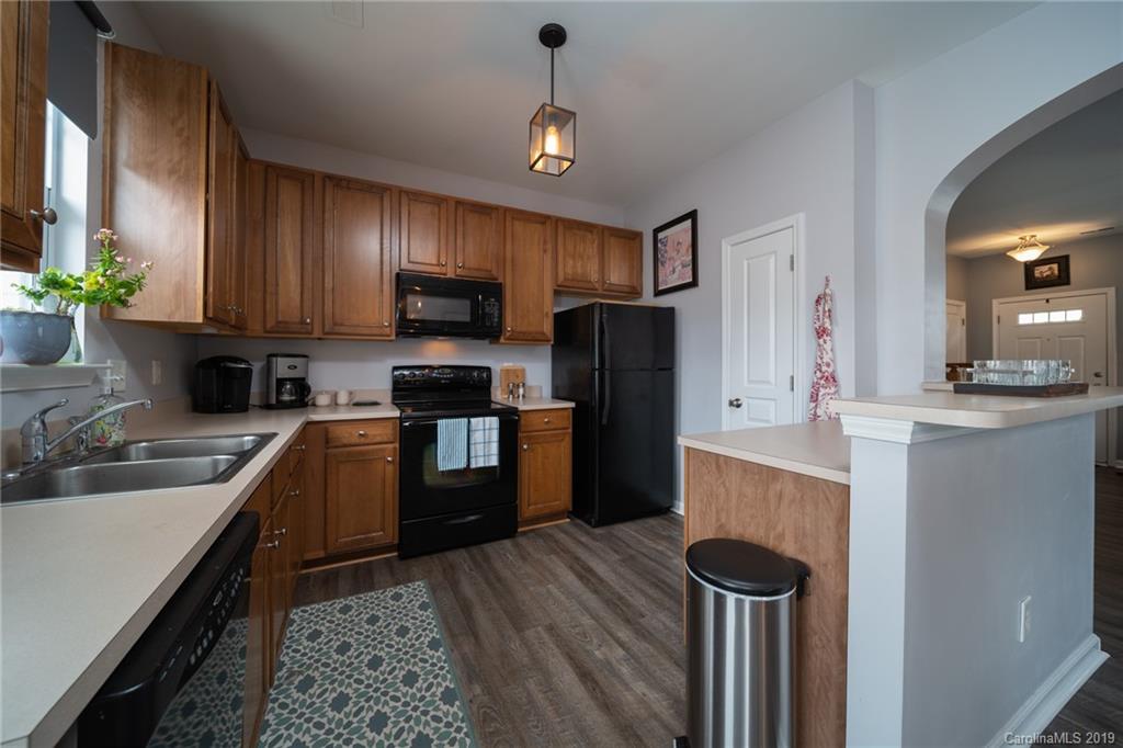 980 Copperstone Lane Fort Mill, SC 29708 - Photo 11 of 27 a kitchen with sink a refrigerator and a stove