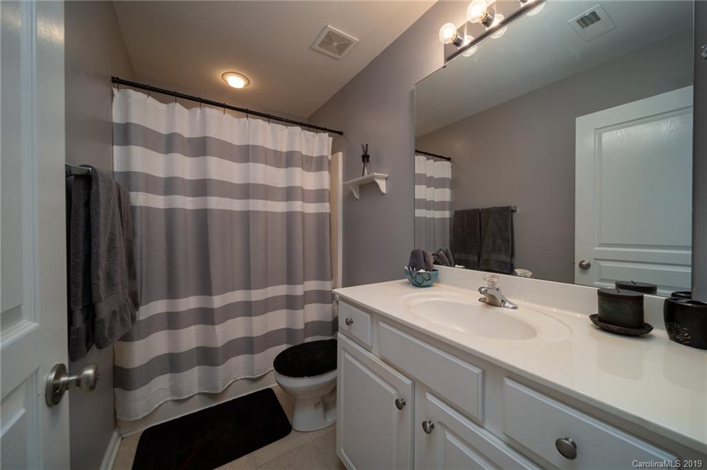 980 Copperstone Lane Fort Mill, SC 29708 - Photo 14 of 27 a bathroom with a sink and a mirror