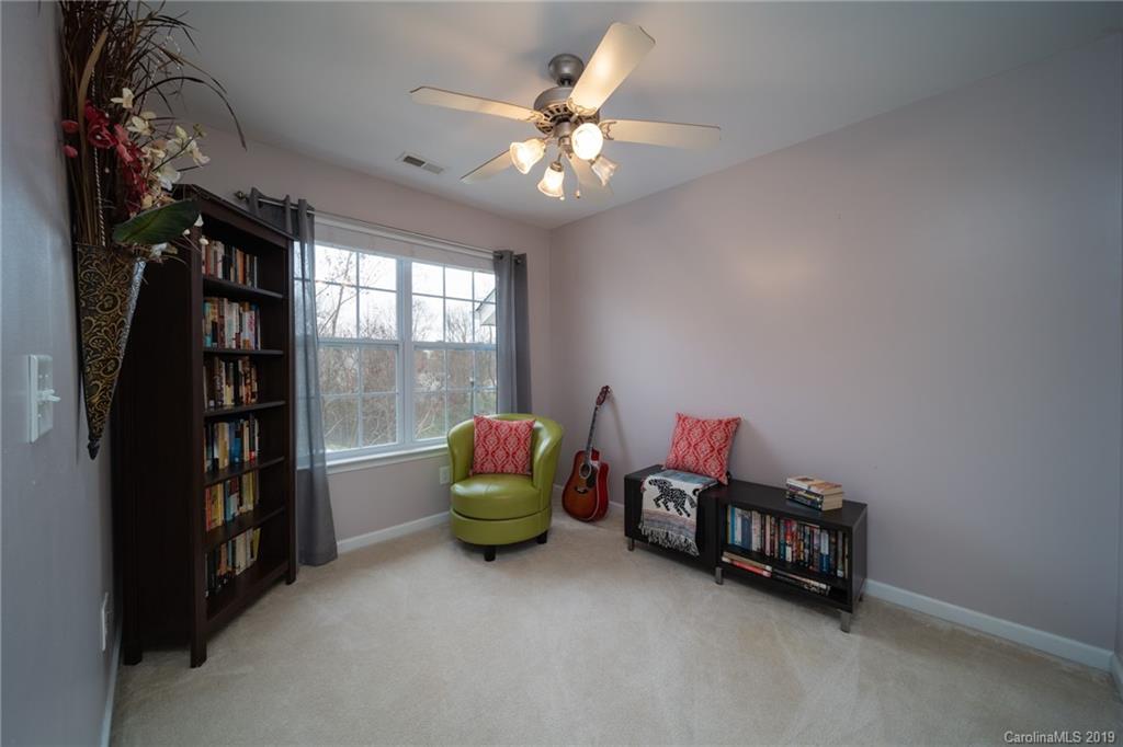 980 Copperstone Lane Fort Mill, SC 29708 - Photo 15 of 27 a room with furniture and a chandelier