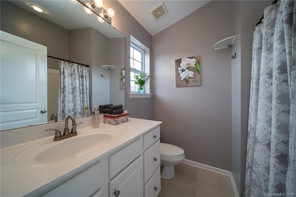 980 Copperstone Lane Fort Mill, SC 29708 - Photo 19 of 27 a bathroom with a sink toilet and shower