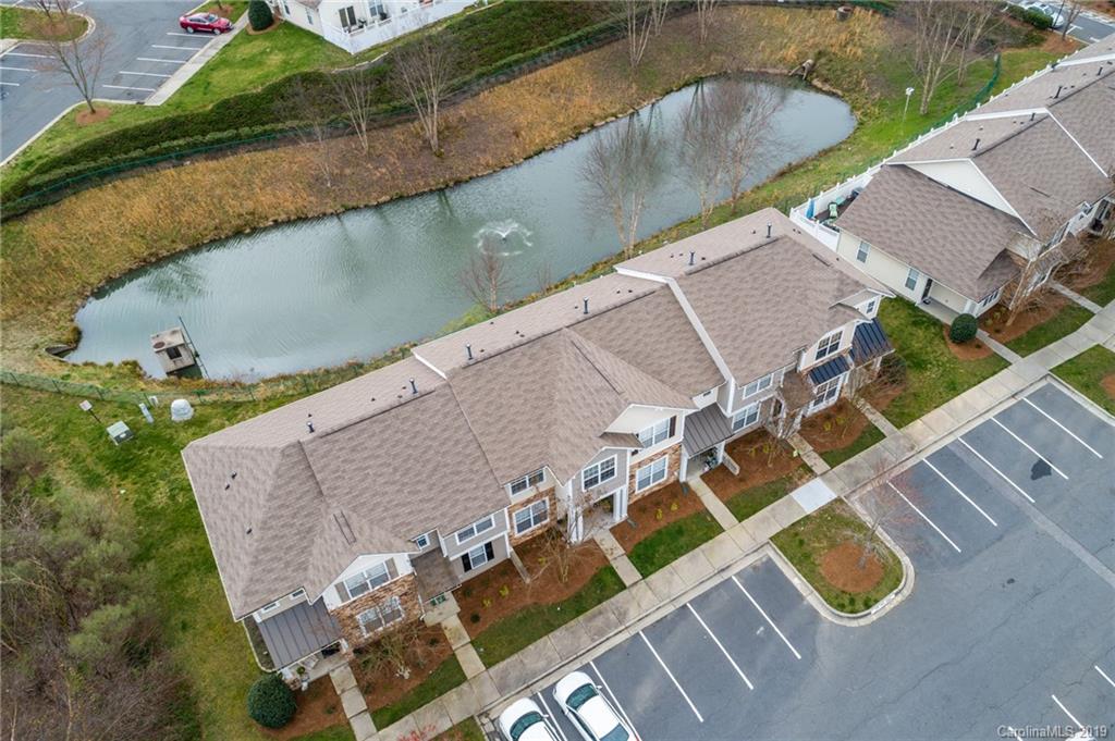 980 Copperstone Lane Fort Mill, SC 29708 - Photo 25 of 27 an aerial view of a house with a yard and a large pool