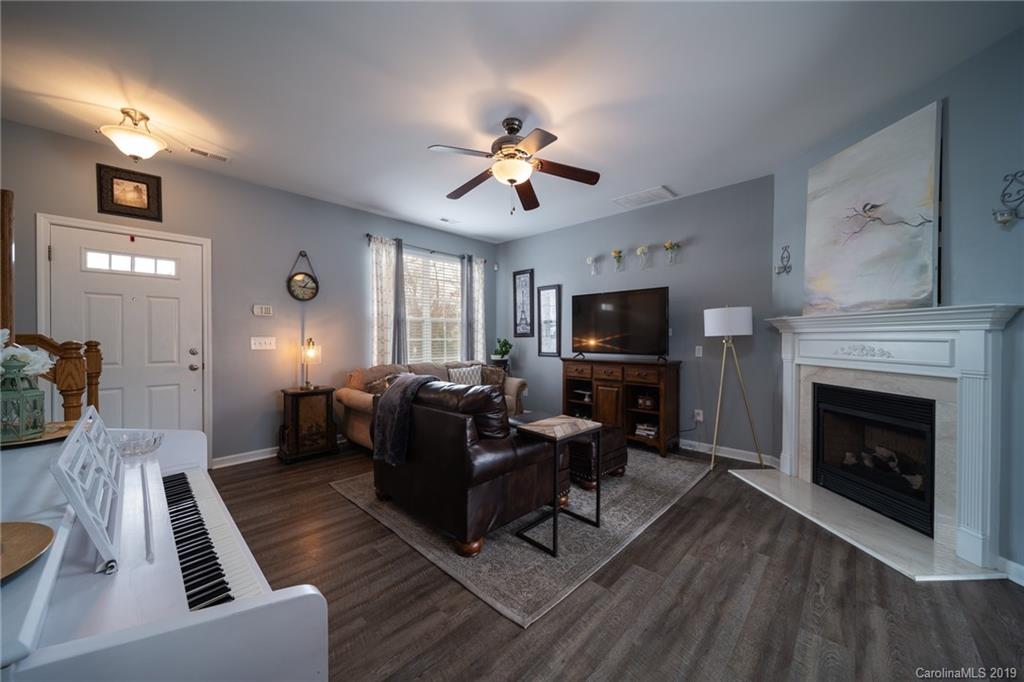 980 Copperstone Lane Fort Mill, SC 29708 - Photo 5 of 27 a living room with furniture and a fireplace