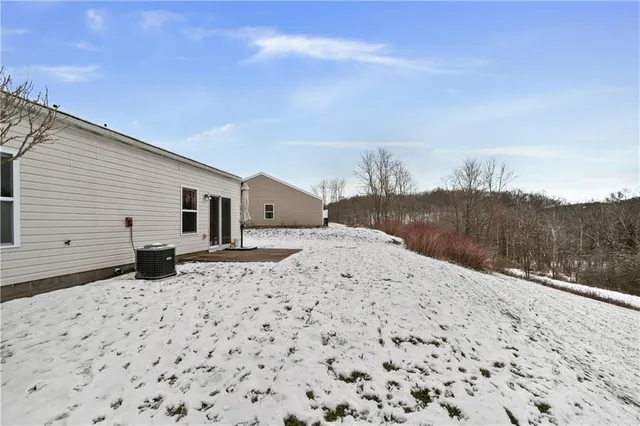 a view of a backyard of the house