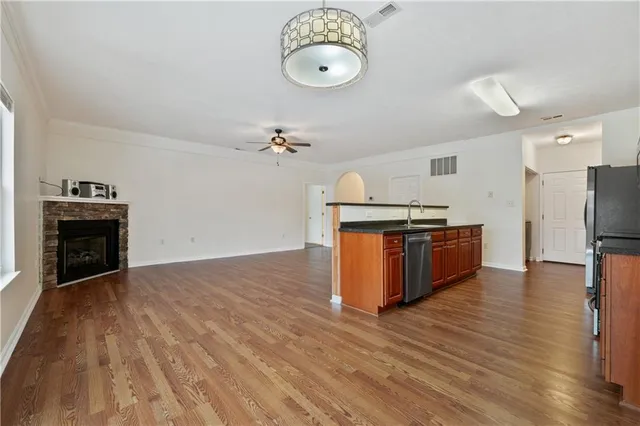 a view of kitchen with sink microwave and stove