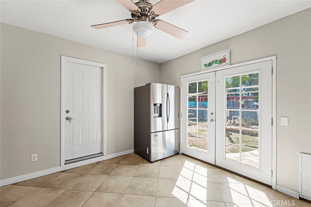 40069 East Newport Road Hemet, CA 92543 - Photo 15 of 64 a view of a refrigerator in kitchen and windows