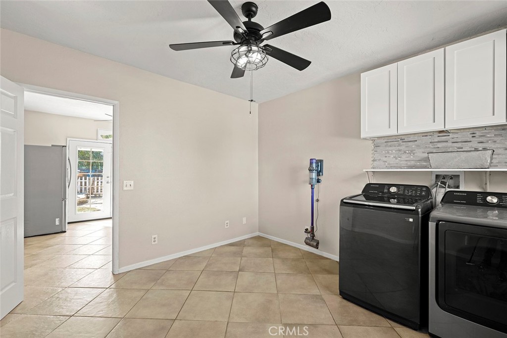 40069 East Newport Road Hemet, CA 92543 - Photo 18 of 64 a kitchen with a stove cabinets and a refrigerator