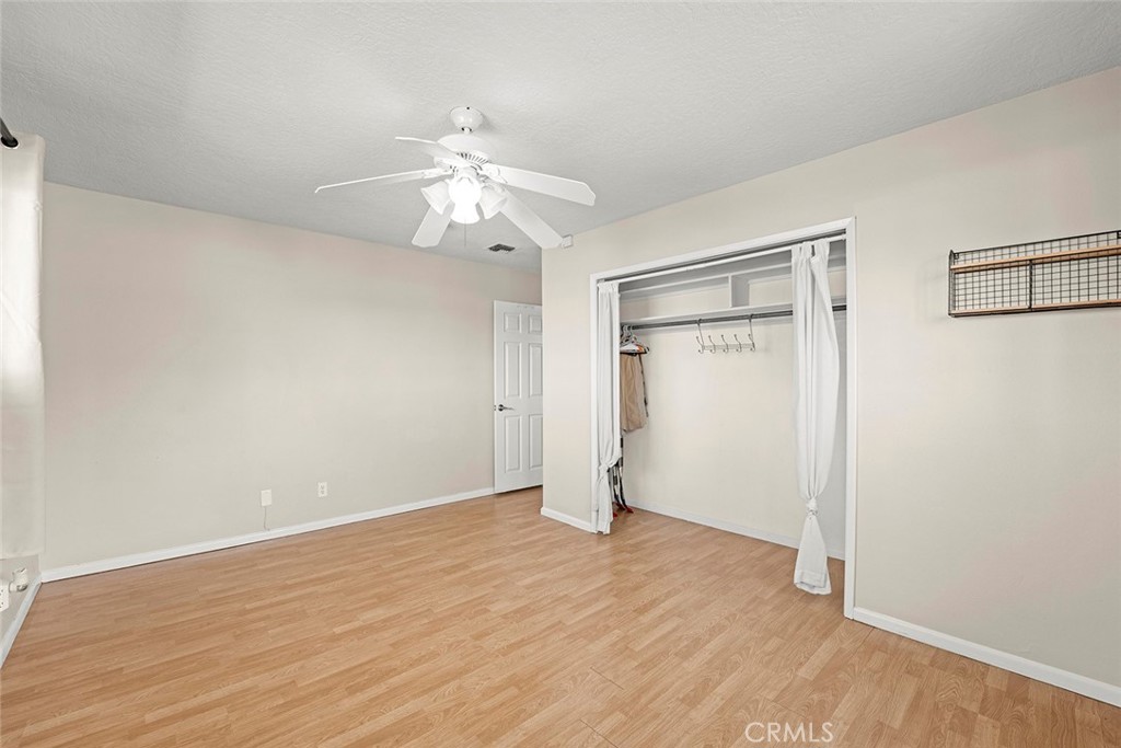 40069 East Newport Road Hemet, CA 92543 - Photo 22 of 64 a view of an empty room with wooden floor