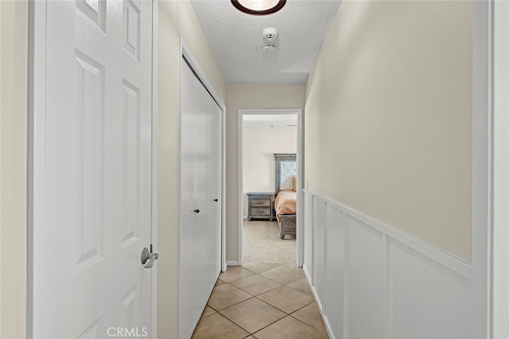 40069 East Newport Road Hemet, CA 92543 - Photo 25 of 64 a view of a hallway with a livingroom and a bathroom